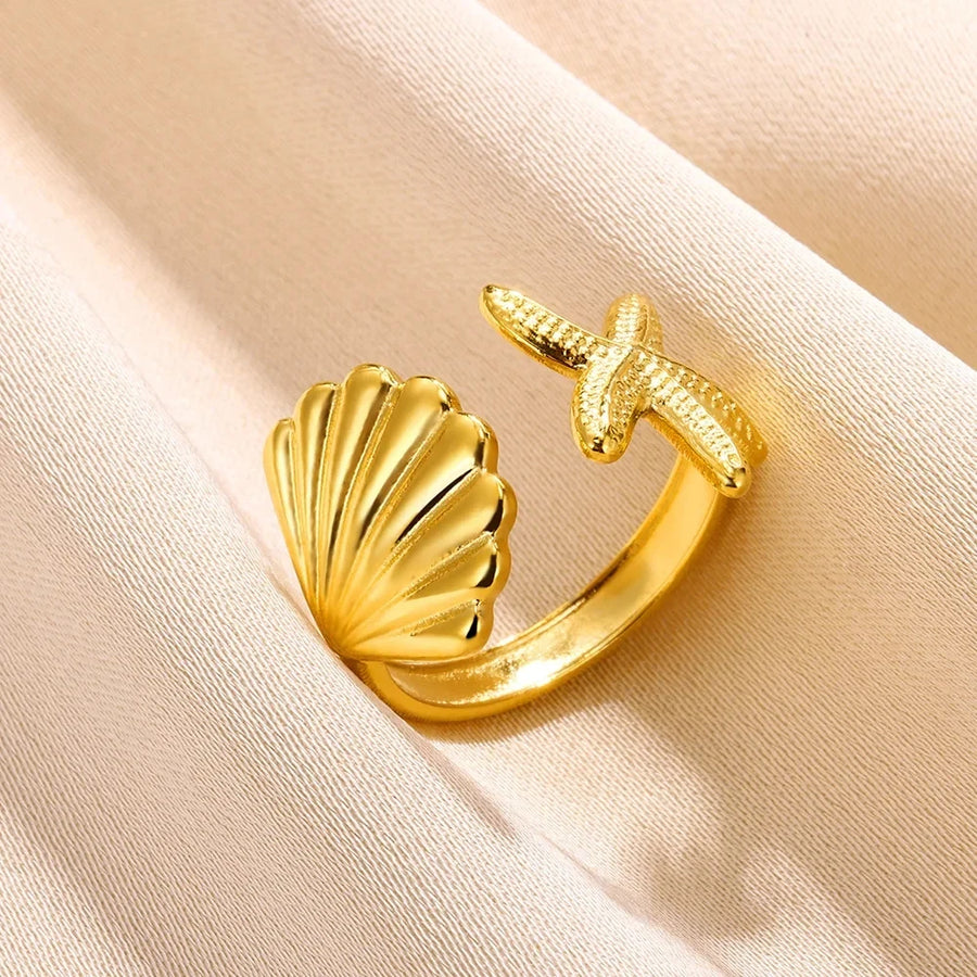 Anello con conchiglia e stella marina