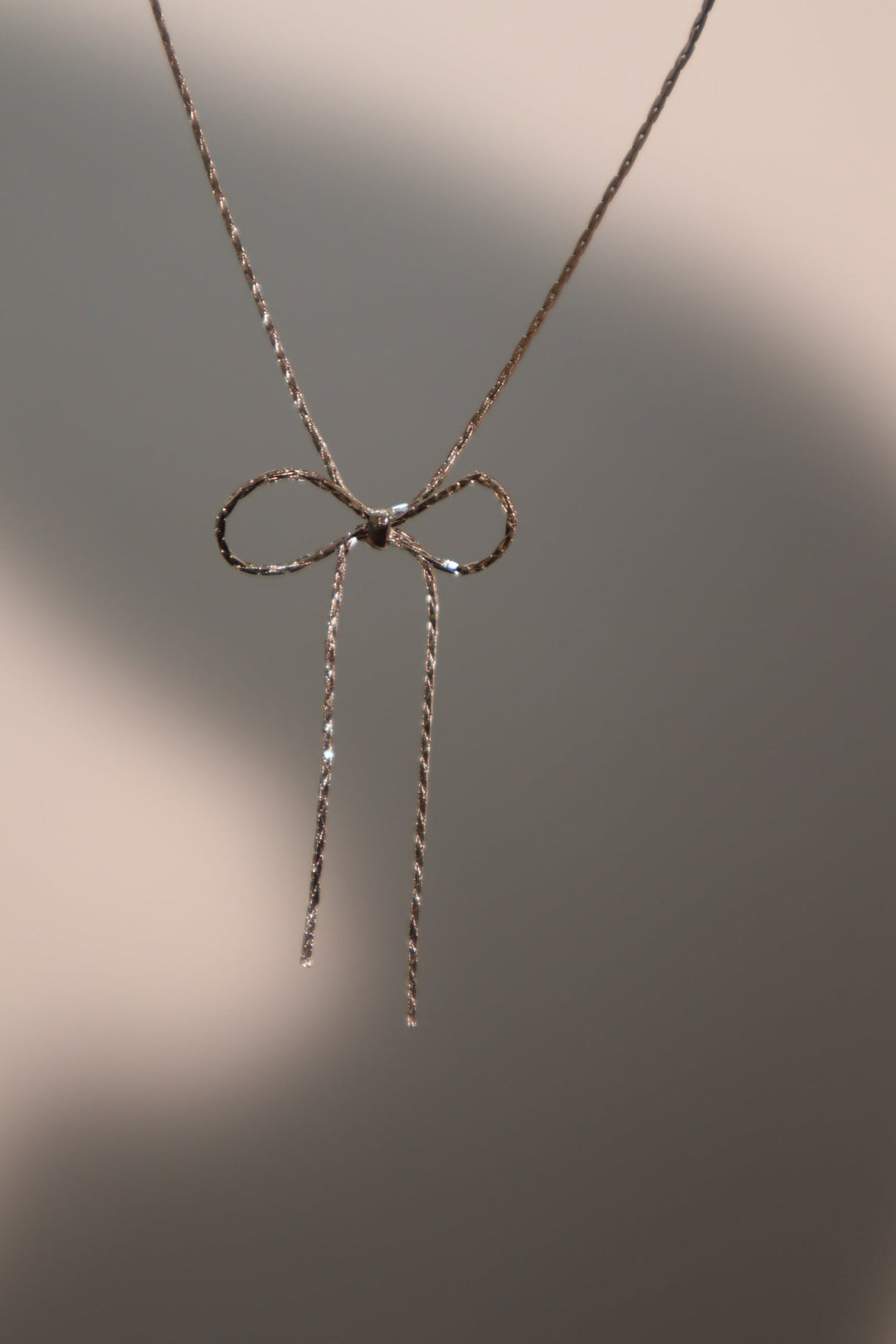 Collana con fiocco in acciaio inossidabile