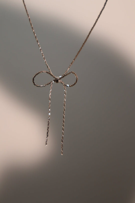 Collana con fiocco in acciaio inossidabile