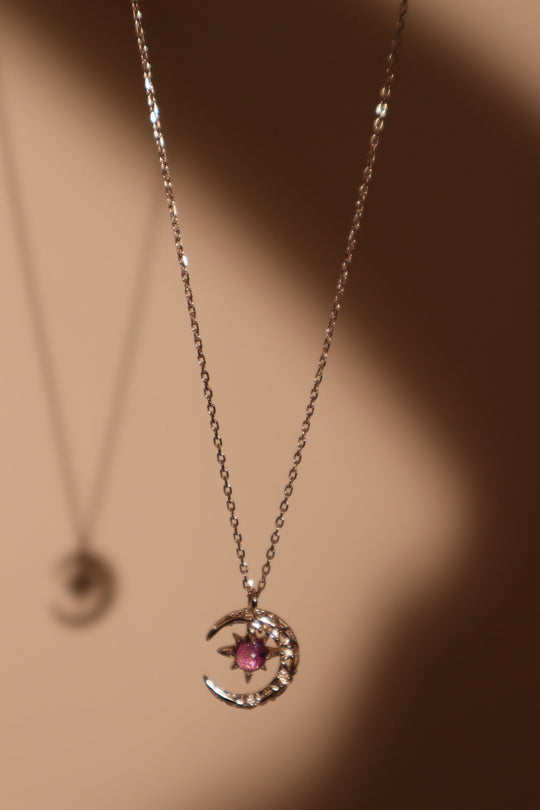 Collana con luna e gemma glitterata viola