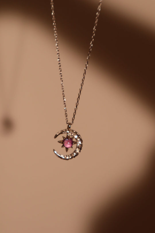 Collana con luna e gemma glitterata viola