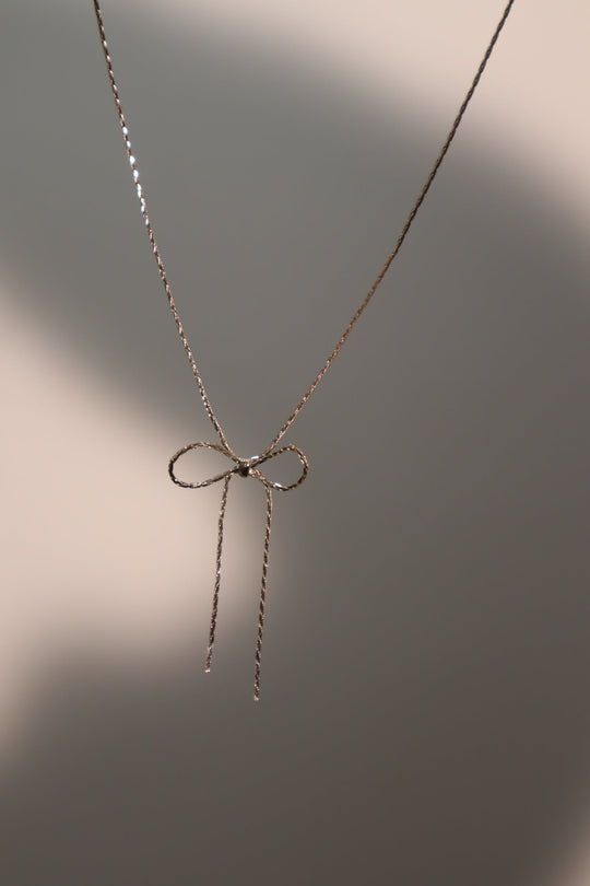 Collana con fiocco in acciaio inossidabile