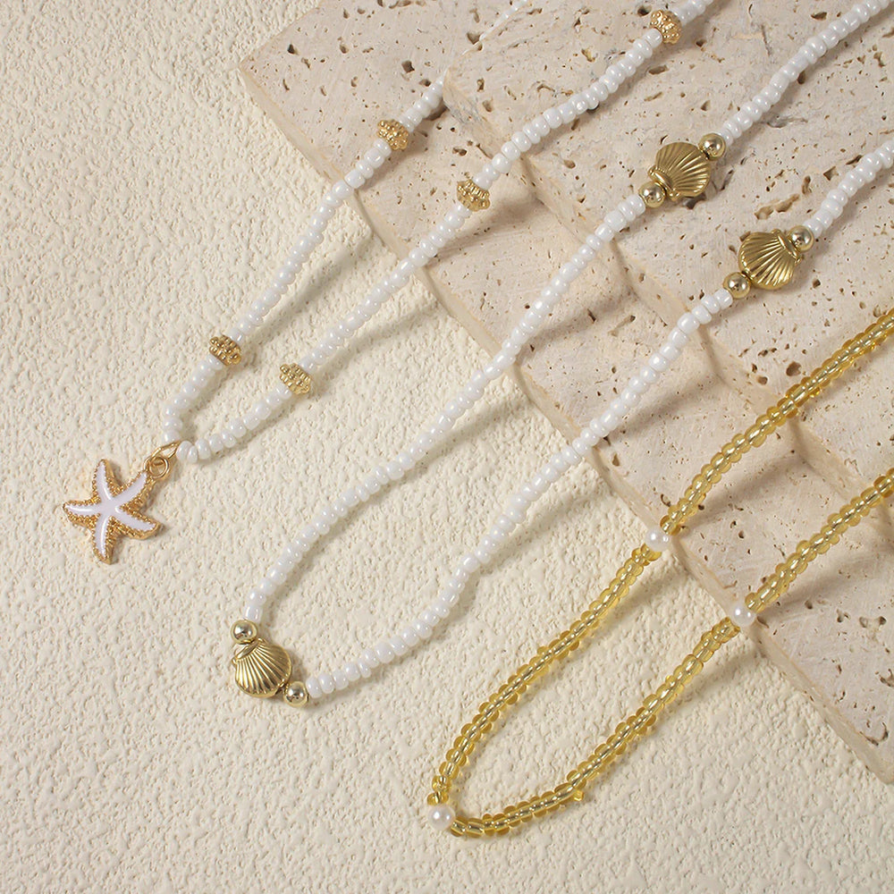 Girocollo vintage con perline multistrato e ciondolo a forma di stella marina e conchiglia