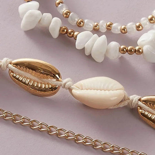 Set di 4 cavigliere con conchiglie e perline