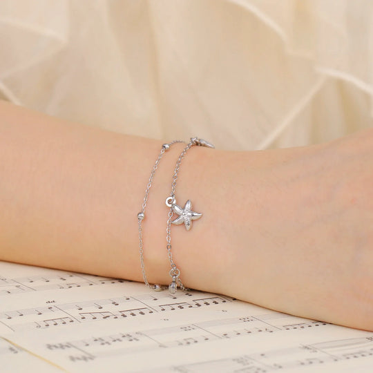 Bracciale da spiaggia con stelle marine e conchiglie