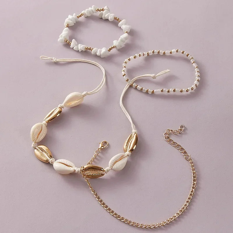 Set di 4 cavigliere con conchiglie e perline
