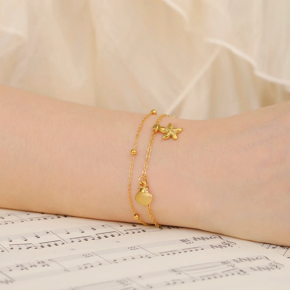 Bracciale da spiaggia con stelle marine e conchiglie