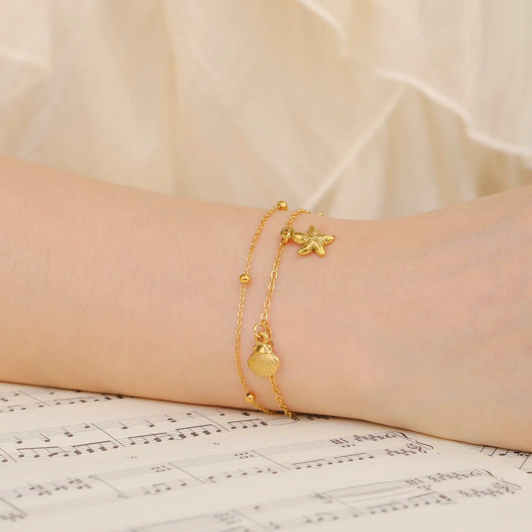Bracciale da spiaggia con stelle marine e conchiglie